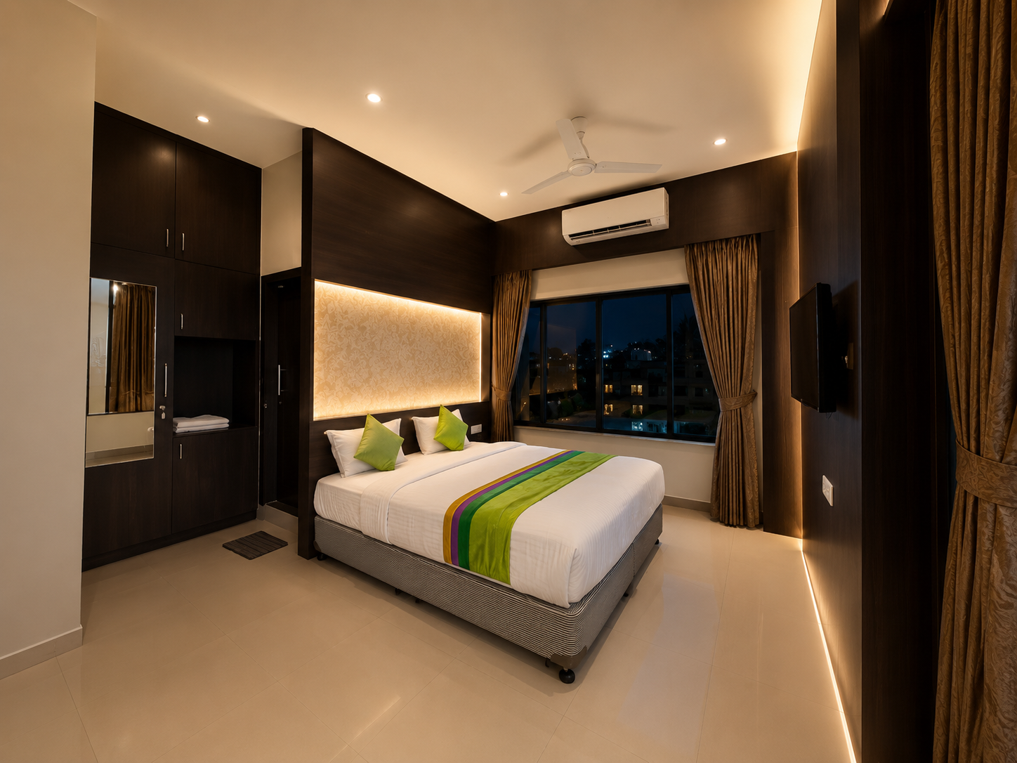 Luxurious bedroom suite at Sai Vijay Hotel